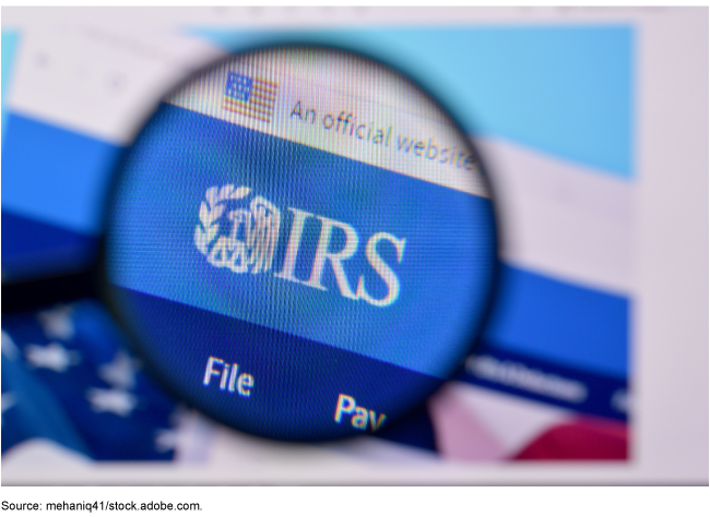 A view of the IRS website through a magnifying glass