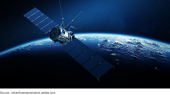 A satellite floating in space with Earth in the background.