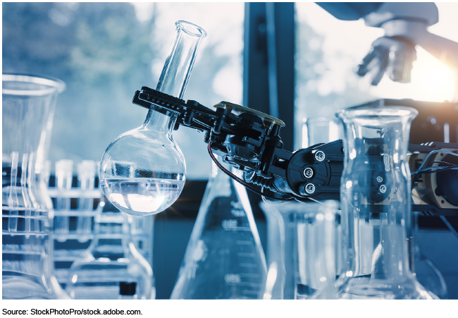 Robotic arm holding a round beaker