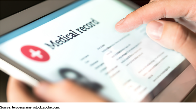 A close up of a medical website on a e-tablet being held in someone's hands.