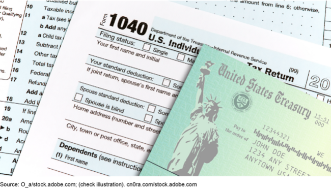 A paper check from the Department of the Treasury on top of a paper copy of the individual tax return Form 1040. A paper check from the Department of the Treasury on top of a paper copy of the individual tax return Form 1040.