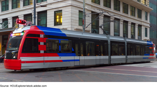 An image of a light rail train in a city.