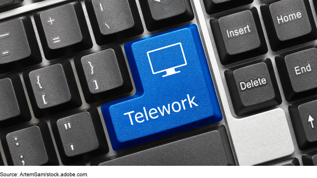 A close-up image of a computer keyboard with the word Telework written on a blue key.