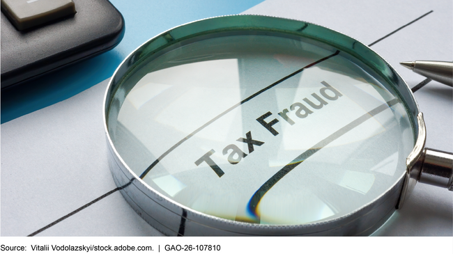 A magnifying glass over the words tax fraud A magnifying glass over the words tax fraud