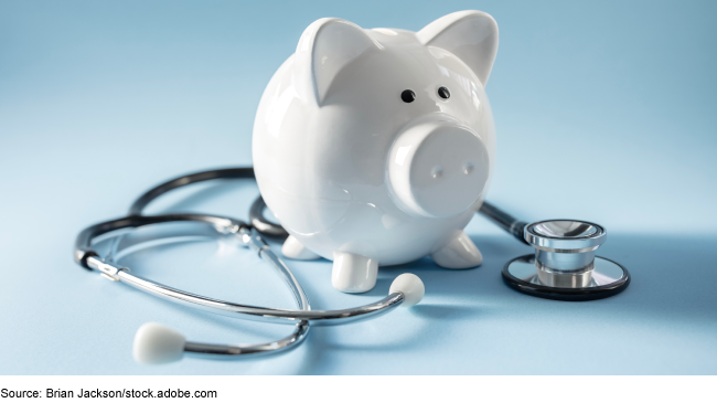 a stethoscope wrapped around a piggy bank