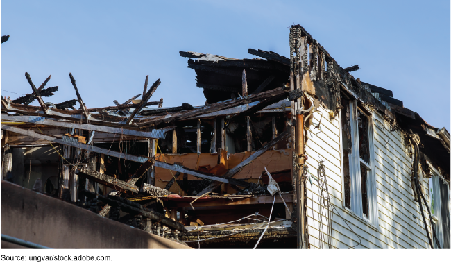 A house damaged in a fire caused by a lightning strike A house damaged in a fire caused by a lightning strike