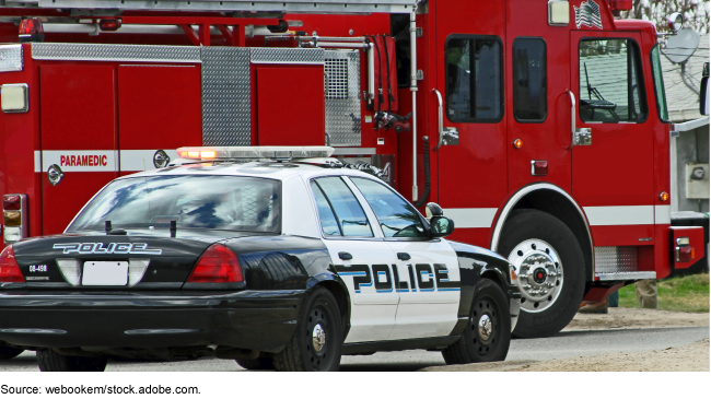 A police and firefighter vehicle parked on a road