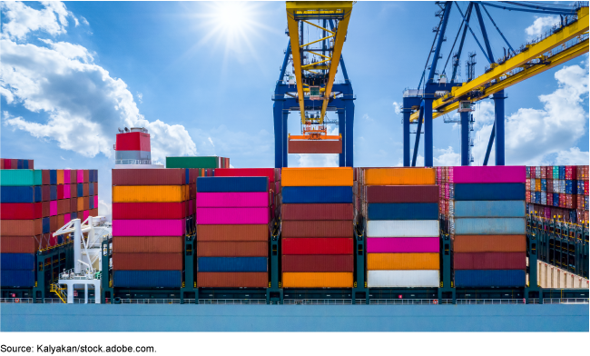 Numerous brightly colored cargo shipping containers stacked in high rows.