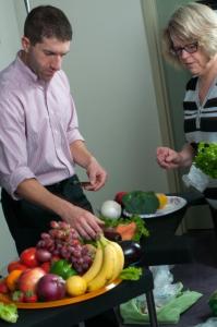 photo of people handling fruit and meat