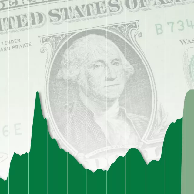 line graph over dollar bill