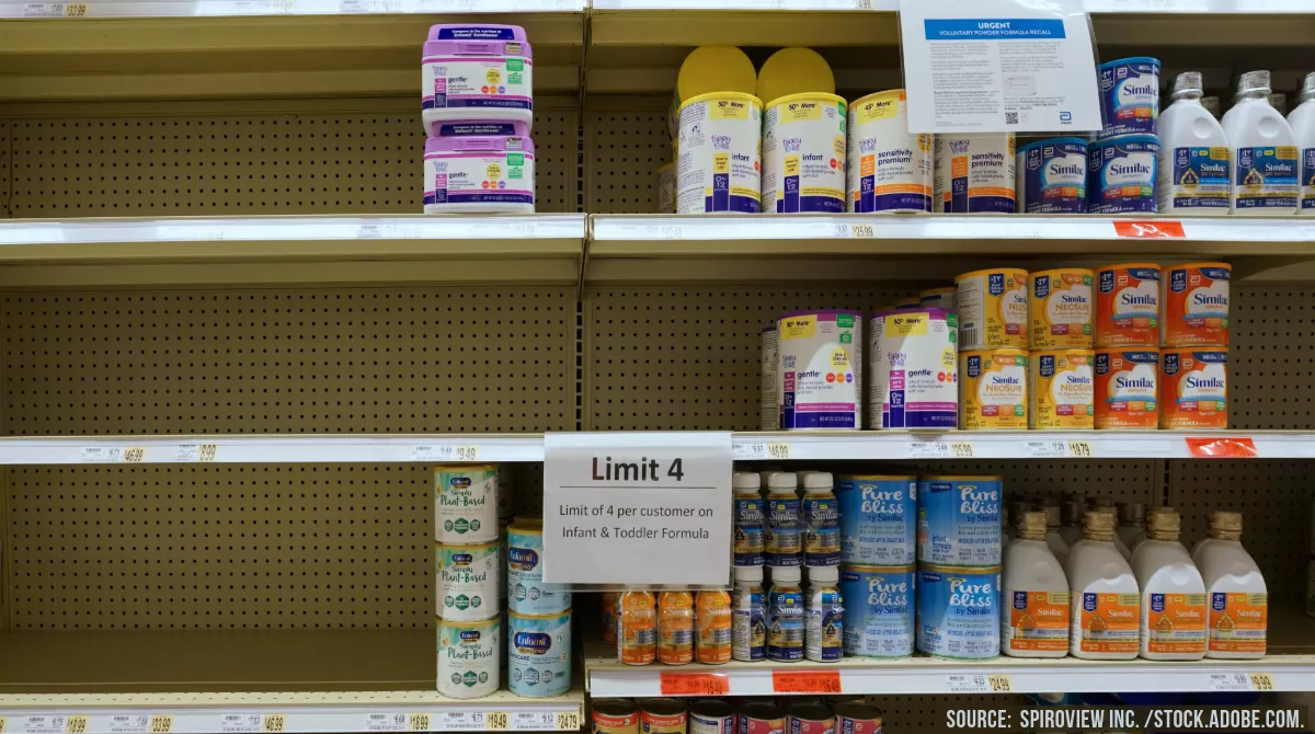 Photo showing empty baby formula shelves at a grocery store.