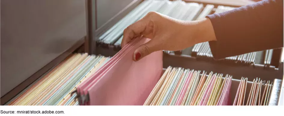 A file cabinet with files.