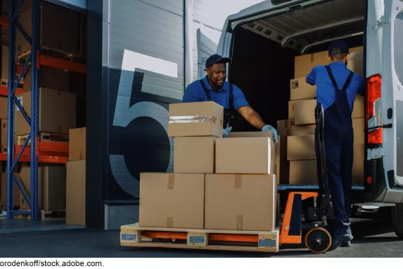 Warehouse workers loading truck