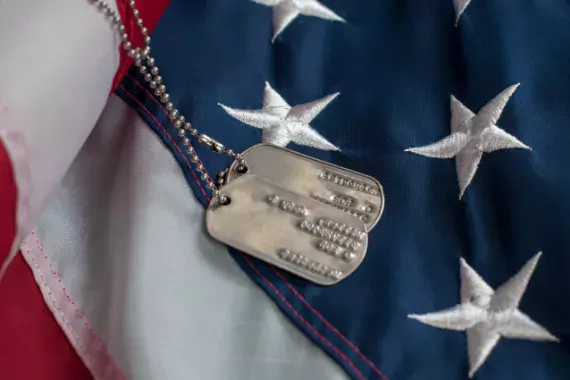 Photo showing dog tags and American flag