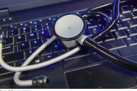 Photo Showing a Stethoscope and a Laptop Computer